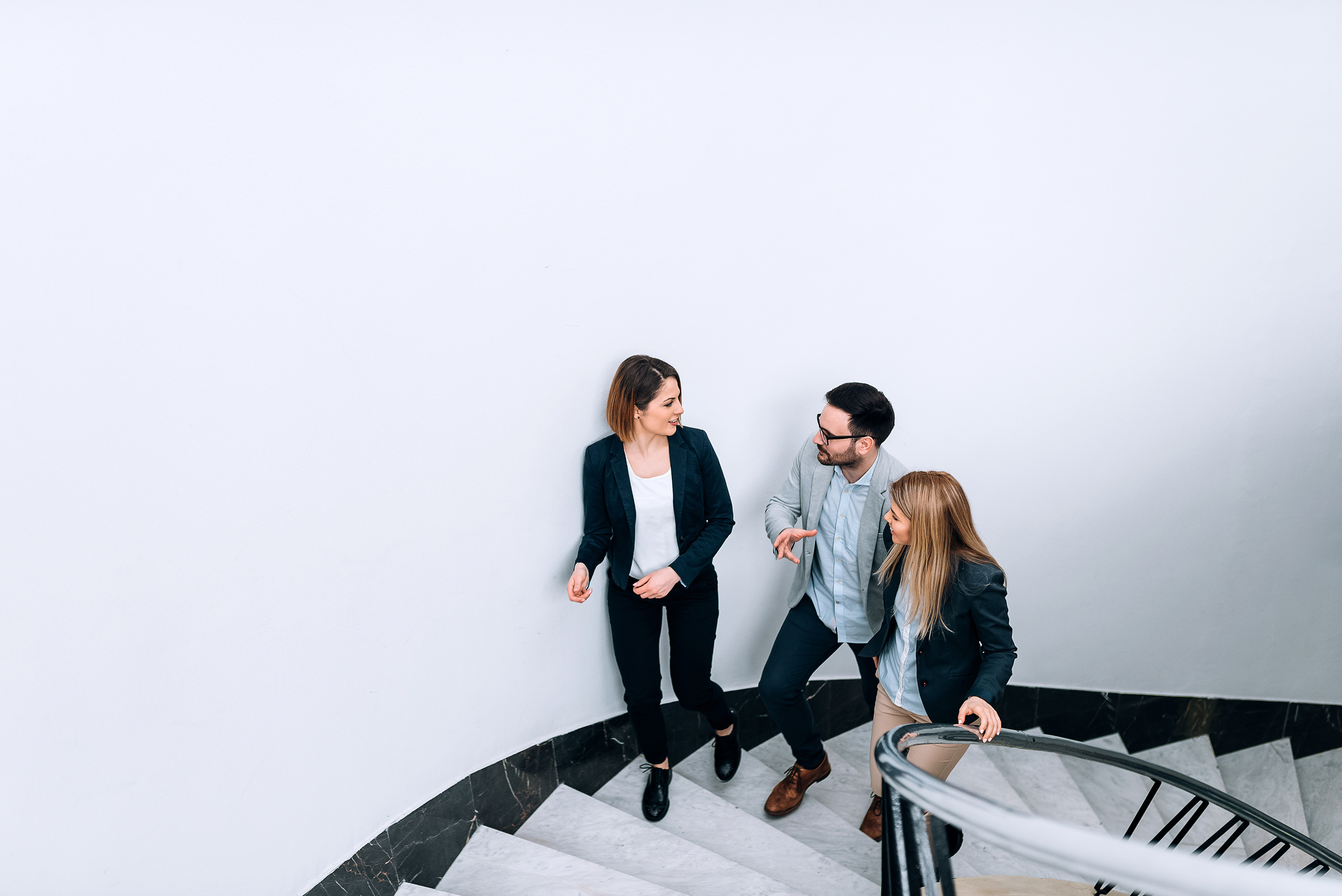 People walking on the stairs at an office